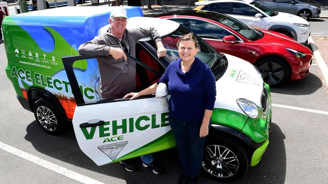 ACE-EV founder and managing director Greg McGarvie and SA Chair of the Australian Electric Vehicle Association Sally Knight with an ACE-EV Cargo van and a new Tesla Model 3 in Adelaide. Picture: AAP/Mark Brake