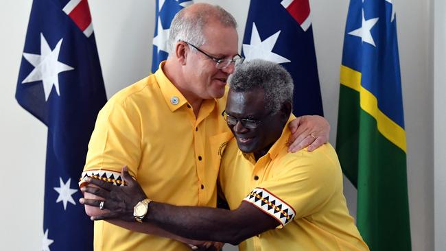 Australia's Prime Minister Scott Morrison greets Solomon Islands Prime Minister Manasseh Sogavare for a bilateral meeting during the Pacific Islands Forum in Funafuti, Tuvalu, in 2019.