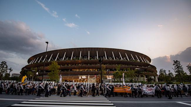 People take part in a protest against the hosting of the 2020 Tokyo Olympic Games in front of the National Stadium in Tokyo on May 9. Picture: Philip Fong/AFP