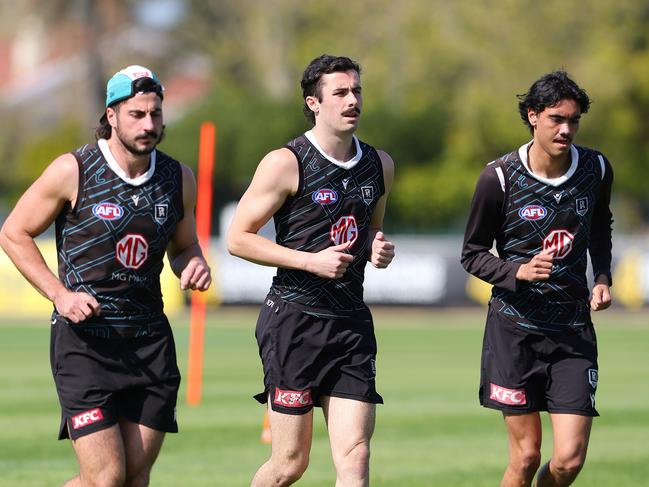 Josh Sinn (middle) alongside close mate Jase Burgoyne (right) and Lachie Jones (left). Picture: Sarah Reed/Getty Images