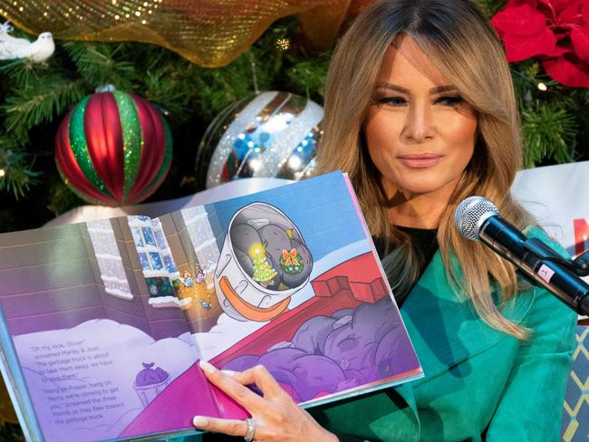 First lady Melania Trump reads a Christmas book to children who are patients at Children's National Hospital on December 15, 2020, in Washington, DC. - Due to pandemic concerns there were two children in the room and the reading was broadcast to children in the rest of the hospital. (Photo by Jacquelyn Martin / POOL / AFP)