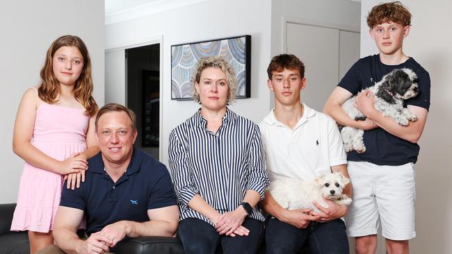 Premier Steven Miles at home with his wife Kim and children Bridie, 10, Sam, 16, and Aidan, 13 (and dogs Lucy and Poppy). Picture: Tara Croser.