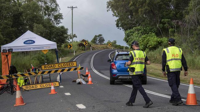 Police check those attempting to enter the indigenous community of Yarrabah south of Cairns during lockdown in 2020. Picture: Brian Cassey