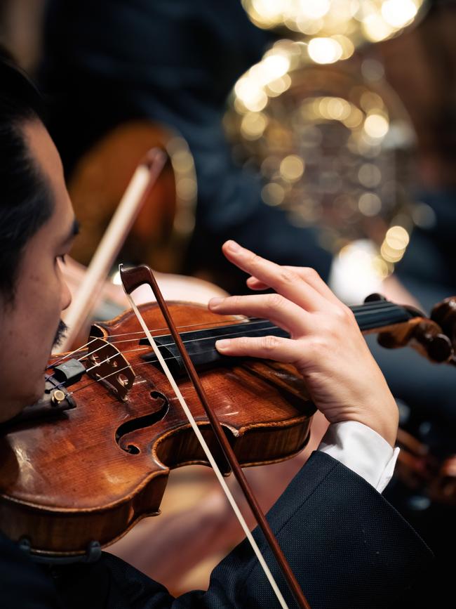 Hobart musician Hayato Simpson leads somewhat of a double life – performing as a violinist with the Tasmanian Symphony Orchestra and also as a DJ under the name Staggersaur Picture: Caleb Miller/Ben Raynor