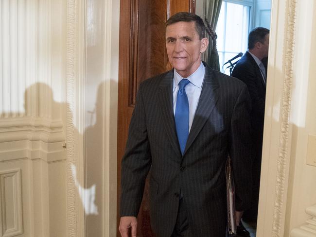 FILE - In this Jan. 22, 2017 file photo, National Security Adviser Michael Flynn arrives for a White House senior staff swearing in ceremony in the East Room of the White House, in Washington. President Donald Trump's former national security adviser has provided so much information to the special counsel's Russia investigation that prosecutors say he shouldn't do any prison time, according to a court filing Tuesday, Dec. 4, 2018, that describes Flynn's cooperation as 