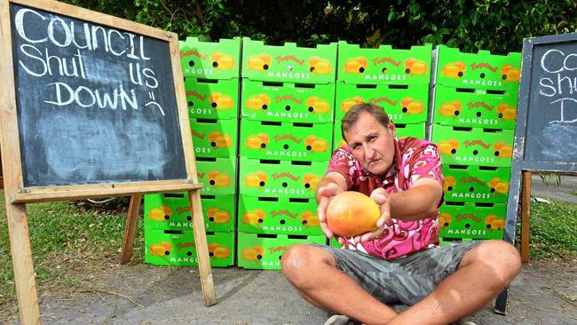 SAD END TO MANGO SEASON: Russel Craig and his wife Pasilika Gaitau-Craig are devastated that Council has ordered them to cease trading in Maud Street, Maroochydore.