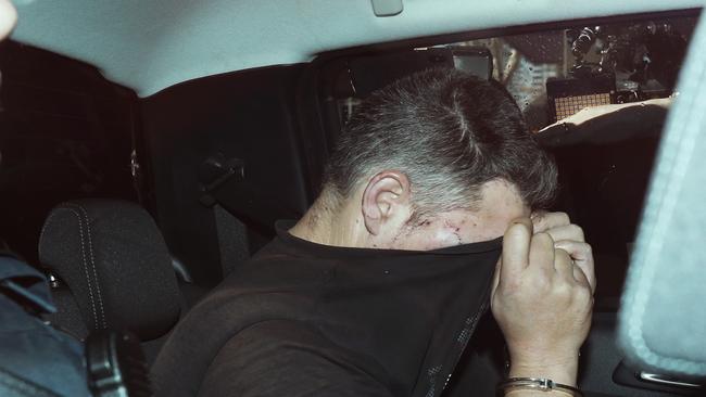 Mr Dick was taken into custody. Picture: AAP Image/David Crosling