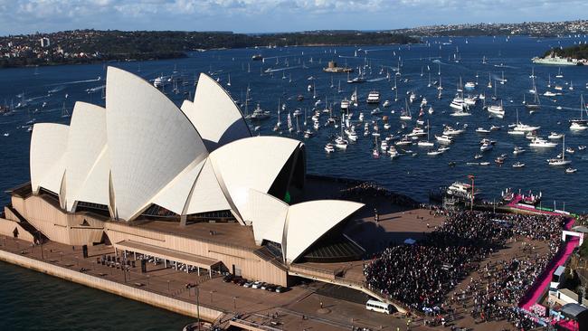 Hundreds of pleasure craft accompany sailor Jessica Watson in her yacht Ella’s Pink Lady as she enters Sydney Harbour in May 2010.