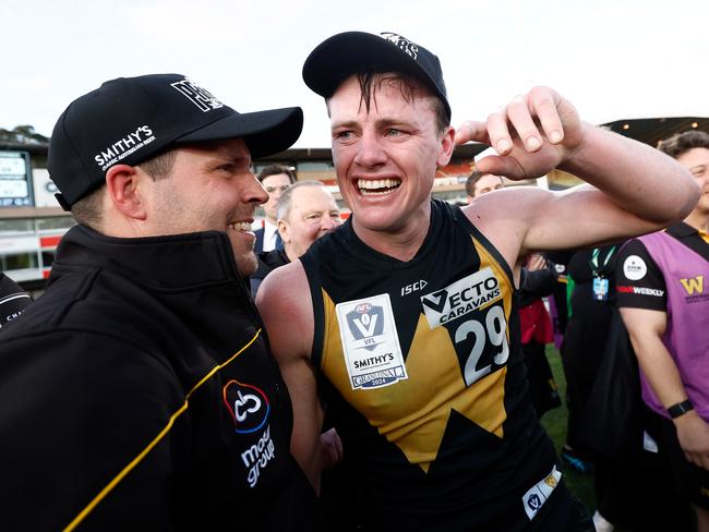 Werribee coach Jimmy Allan and acting captain Dom Brew celebrate their VFL grand final win over Southport. Picture: Michael Willson/AFL Photos via Getty Images