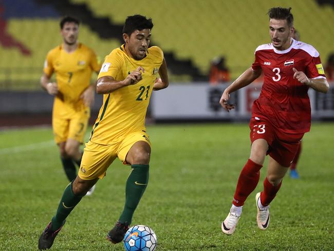 MALACCA, MALAYSIA - OCTOBER 05: Massimo Luongo of Australia runs with the ball during the 2018 FIFA World Cup Asian Playoff match between Syria and the Australia Socceroos at Hang Jebat Stadium on October 5, 2017 in Malacca, Malaysia.  (Photo by Robert Cianflone/Getty Images)