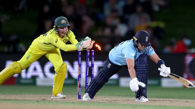 Healy catches Katherine Brunt out of her crease.