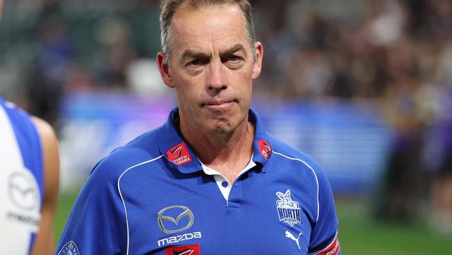 MELBOURNE, AUSTRALIA - APRIL 18: Alastair Clarkson, Senior Coach of the Kangaroos looks on as his players leave the field after the round six AFL match between North Melbourne Kangaroos and Carlton Blues at Marvel Stadium, on April 18, 2025, in Melbourne, Australia. (Photo by Daniel Pockett/Getty Images)