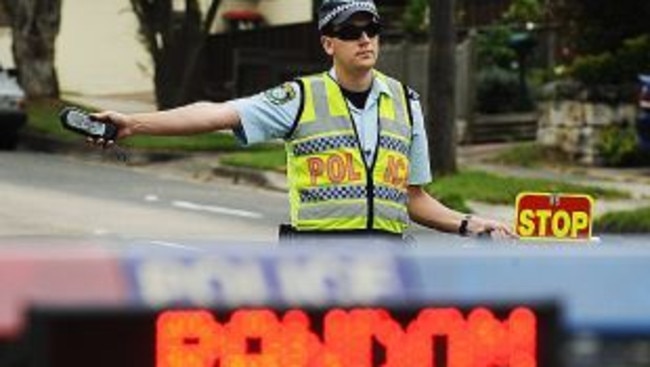 Constables Elizabeth Drake and Brendan Gregory of Northern Beaches Highway Patrol conduct random breath testing on Sydney Road, Balgowlah on Easter Monday. Pic. Braden Fastier rbt logox