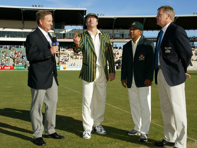 JULY 18, 2003: Australian cricket captain Steve Waugh tosses the coin as Bangladesh captain Khaled Mahmud (2/R) looks on as match referee Mike Proctor (R) and former Australian wicketkeeper Ian Healy watch at Marrara Oval.