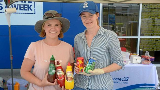 Centacare CQ's Danielle Mitchell and Anna Morris held a susage sizzle Sunday to raise money for their School Savvy project. Picture: Jann Houley