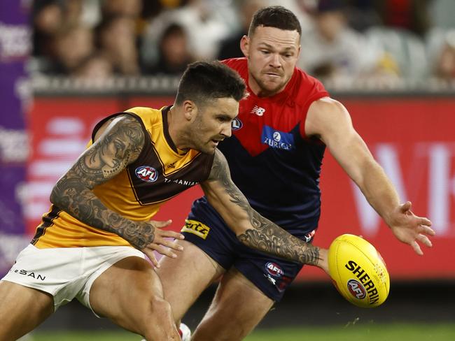 MELBOURNE, AUSTRALIA - APRIL 30: Chad Wingard of the Hawks and Steven May of the Demons compete during the round seven AFL match between the Melbourne Demons and the Hawthorn Hawks at Melbourne Cricket Ground on April 30, 2022 in Melbourne, Australia. (Photo by Darrian Traynor/AFL Photos/Getty Images)