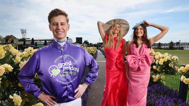 Jockey Fred Kersley wearing Good Friday Appeal silks with Gemma Ward and Rebecca Harding, the special guests of 2024 Crown Oaks Day. Picture: David Caird