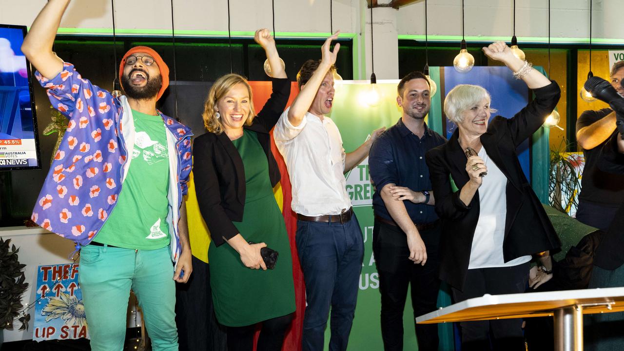 Greens members celebrate Max Chandler-Mather’s victory in Griffith. Picture: Richard Walker