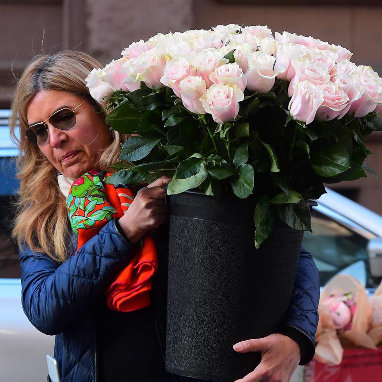 Is it a boy or a girl? Pink flowers here but there were an array of coloured flowers delivered to the hotel. Picture: Splash News 