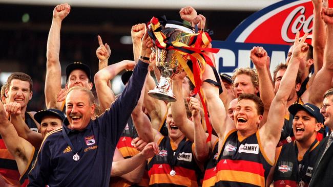 Adelaide’s Malcolm Blight and Mark Bickley hold the 1998 AFL Premiership trophy.