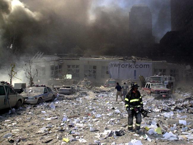 NYC Firefighters walk through whets left of the World Trade Centre Towers soon after their collapse following a terrorist attack on September 11 2001. Picture: Nathan Edwards