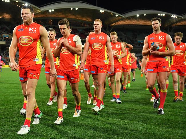 ADELAIDE, AUSTRALIA - AUGUST 26: Steven May of the Suns leads his team from the field after being defeated by the Power during the round 23 AFL match between the Port Adelaide Power and the Gold Coast Suns at Adelaide Oval on August 26, 2017 in Adelaide, Australia.  (Photo by Daniel Kalisz/Getty Images)