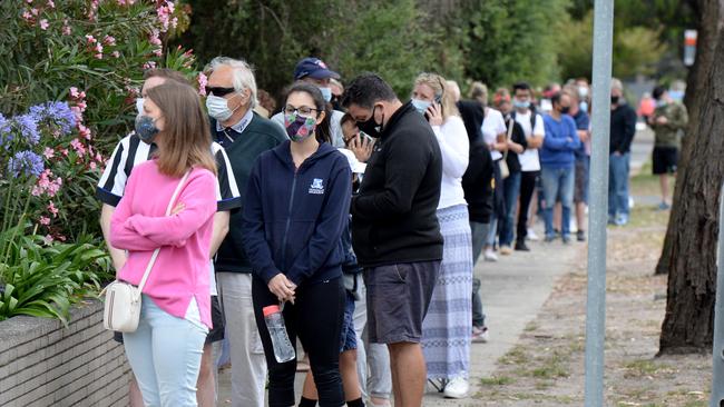 People queue for COVID-19 tests outside Sandringham Hospital after recent coronavirus cases in suburban Melbourne. Picture: Andrew Henshaw