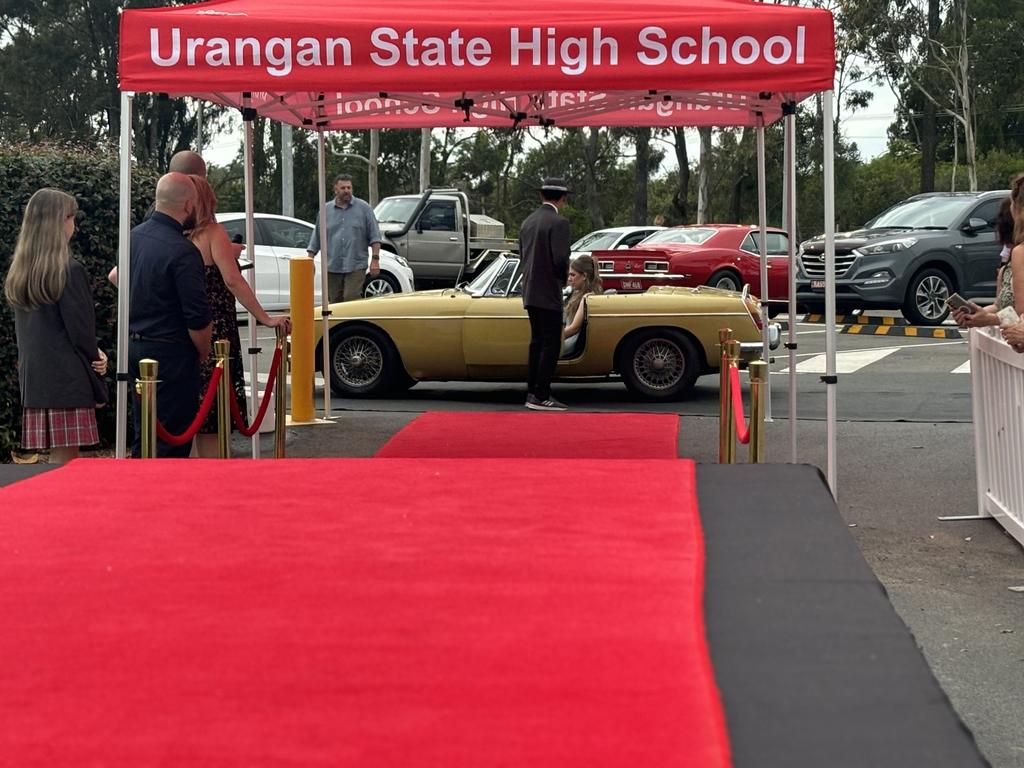 Students from Urangan State High School arrive at their formal.