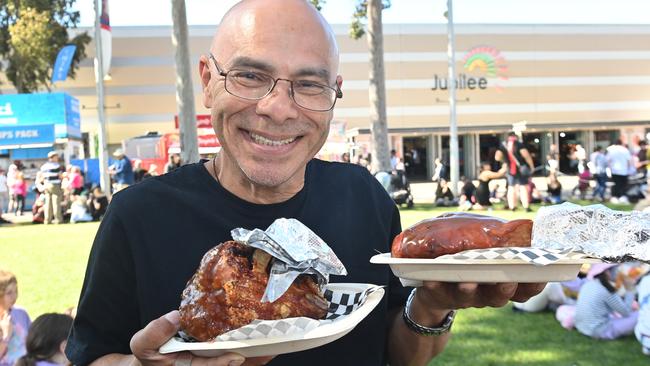 Rolando Alfaro with turkey legs and pork knuckle at the Royal Adelaide Show. Picture: Keryn Stevens