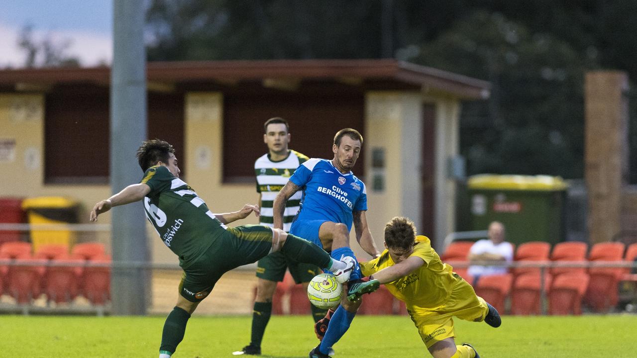 Brodie Welch of South West Queensland Thunder is denied by Western Pride keeper Tom Lynch and defender Ryu Yonezawain in FQPL men round three football at Clive Berghofer Stadium, Saturday, March 7, 2020. Picture: Kevin Farmer