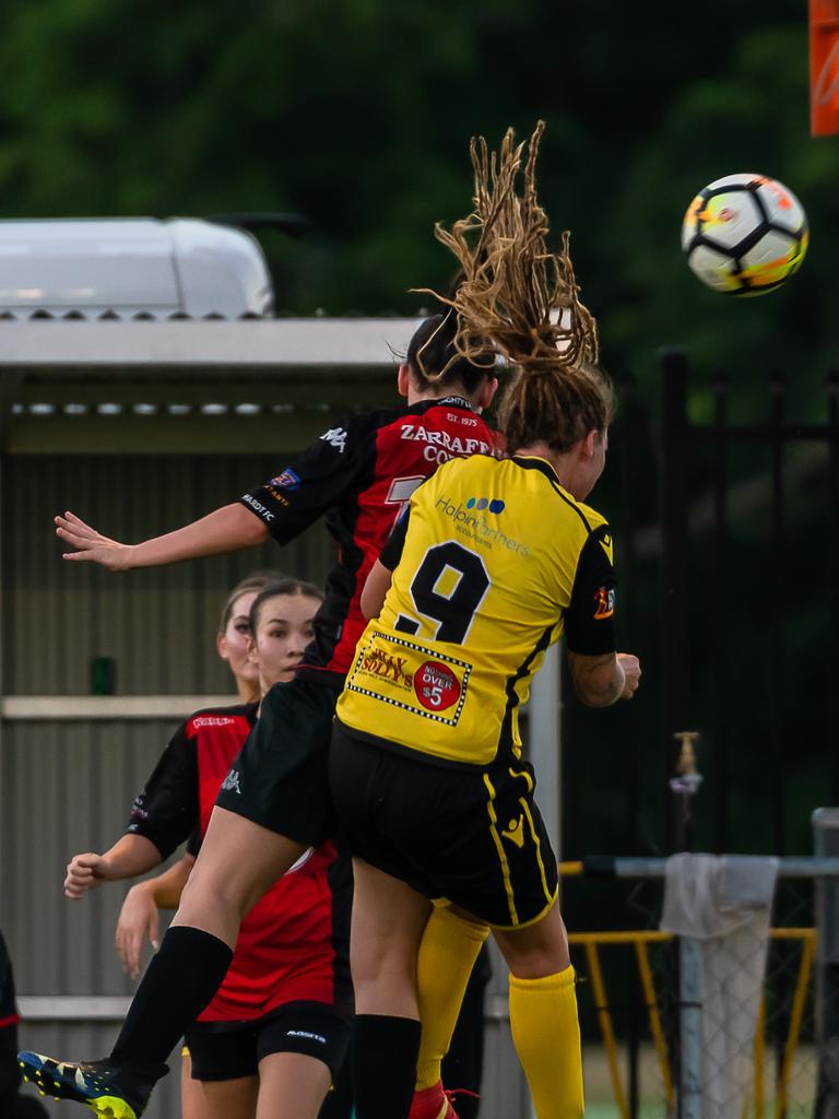 Edge Hill United's Siobhan Macken takes flight with Leichardt's Alacia Lazarus. Picture: Emily Barker