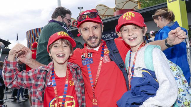 Henry and Rhett McCormack with Ethan Crompton before the Suns V Freo at People First Stadium Cararra. Picture: Glenn Campbell