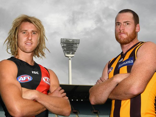 MELBOURNE, AUSTRALIA - MARCH 21:  Dyson Heppell of the Bombers and Jarryd Roughead of the Hawks pose during an AFL media opportunity  at Melbourne Cricket Ground on March 21, 2017 in Melbourne, Australia.  (Photo by Quinn Rooney/Getty Images)