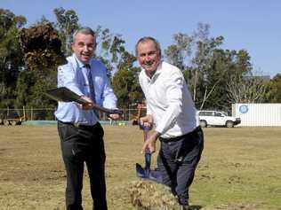 DIGGING IN: Kevin Hogan and Chris Gulaptis turn the first sod at the Dougherty Villa extension. Picture: Caitlan Charles