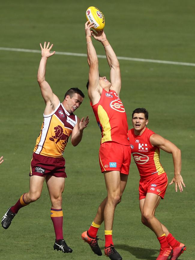 Chris Burgess of the Suns takes a mark. Picture: Getty Images