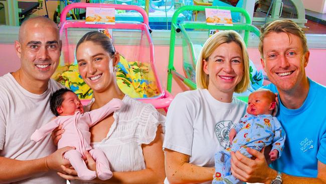 Real estate agents with their new born bundles of joy, from left, Gracie and Damon Warat with baby Gigi and, Courtney and Simon Caulfield, who christened their baby Krug, after the champagne. Pictures: Contributed