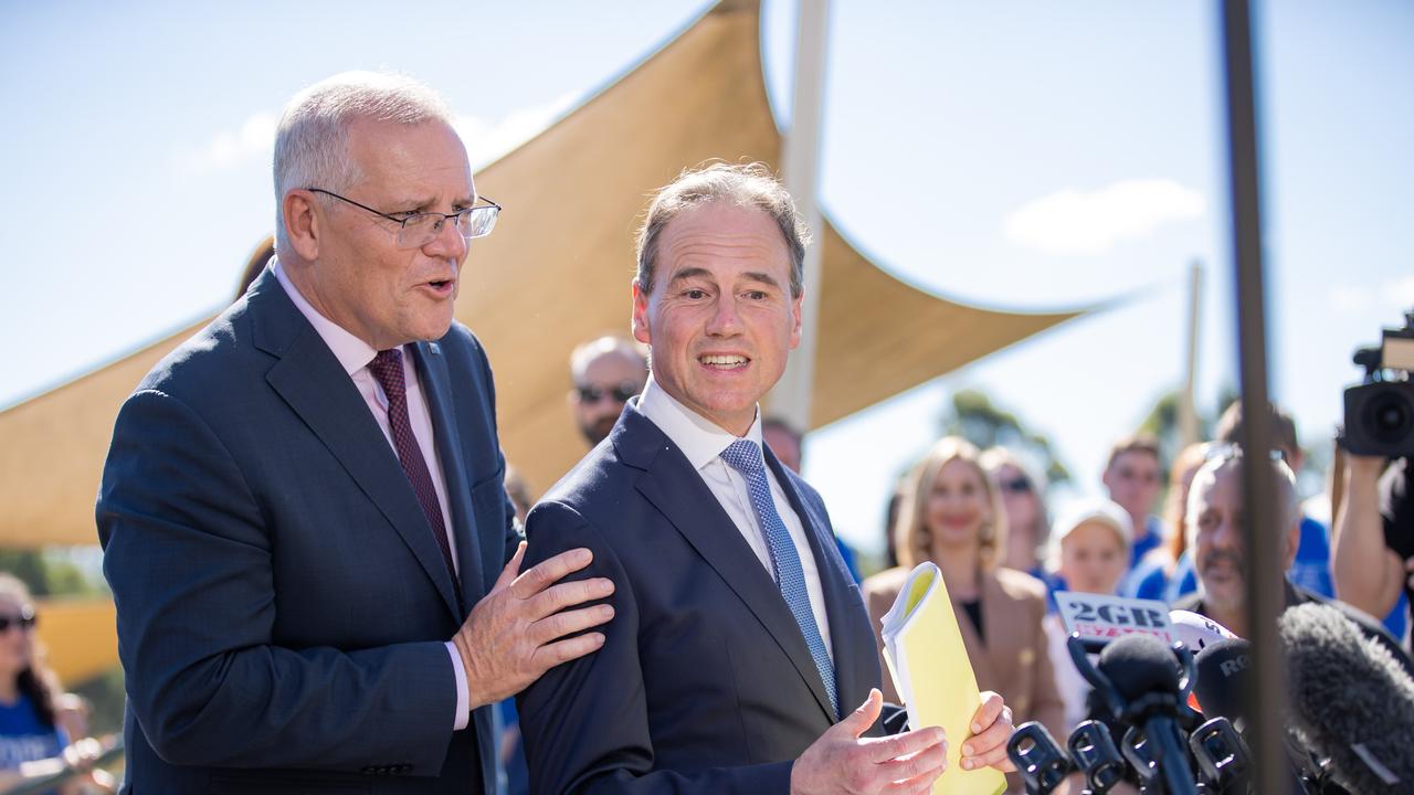 The PM stops Greg Hunt mid sentence as he almost accidentally announces the new health Minister. Picture: Jason Edwards