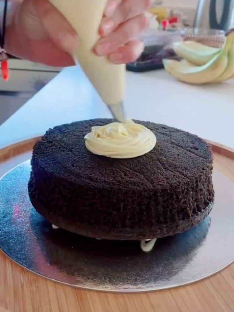 First place one cake upside down on a cake board. Picture: TikTok