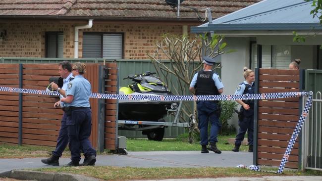 Police at the scene at Noela Pl, Budgewoi. Five people, aged in their 20s, have been taken to hospital. Picture: Richard Noone