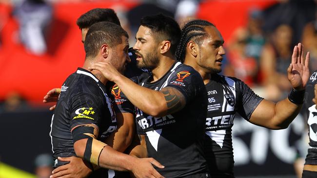 New Zealand players celebrate a try against Scotland.