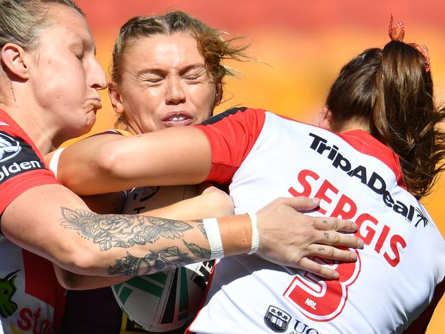 Julia Robinson (centre) of the Broncos is tackled by Holli Wheeler (left) and Jessica Sergis (right) of the Dragons during the NRL Women's Premiership match between the Brisbane Broncos and the St George-Illawarra Dragons at Suncorp Stadium in Brisbane, Sunday, September 9, 2018. (AAP Image/Darren England) NO ARCHIVING, EDITORIAL USE ONLY