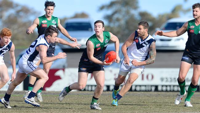 Greenvale's Jarryd Bonello looks for a teammate during his side’s match with Avondale Heights last month. Photo: Josie Hayden