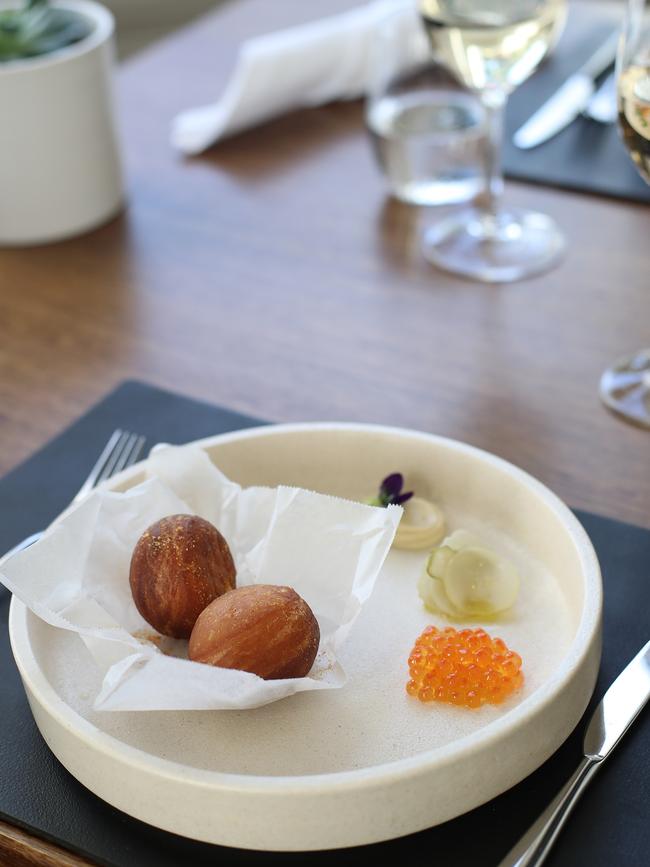 Beignet, burnt cream, pickles and salmon roe. Pictures: LUKE BOWDEN