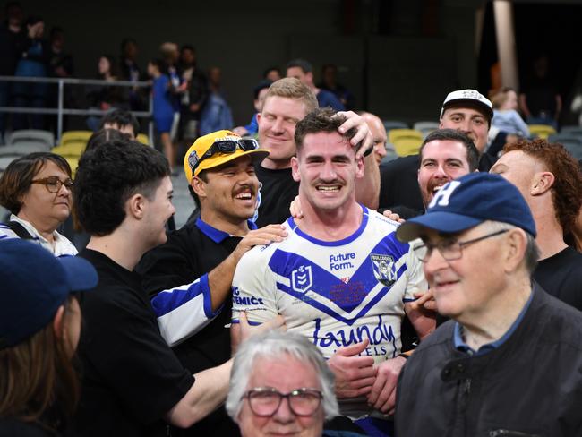 Harry Hayes celebrates his NRL debut with friends and family.