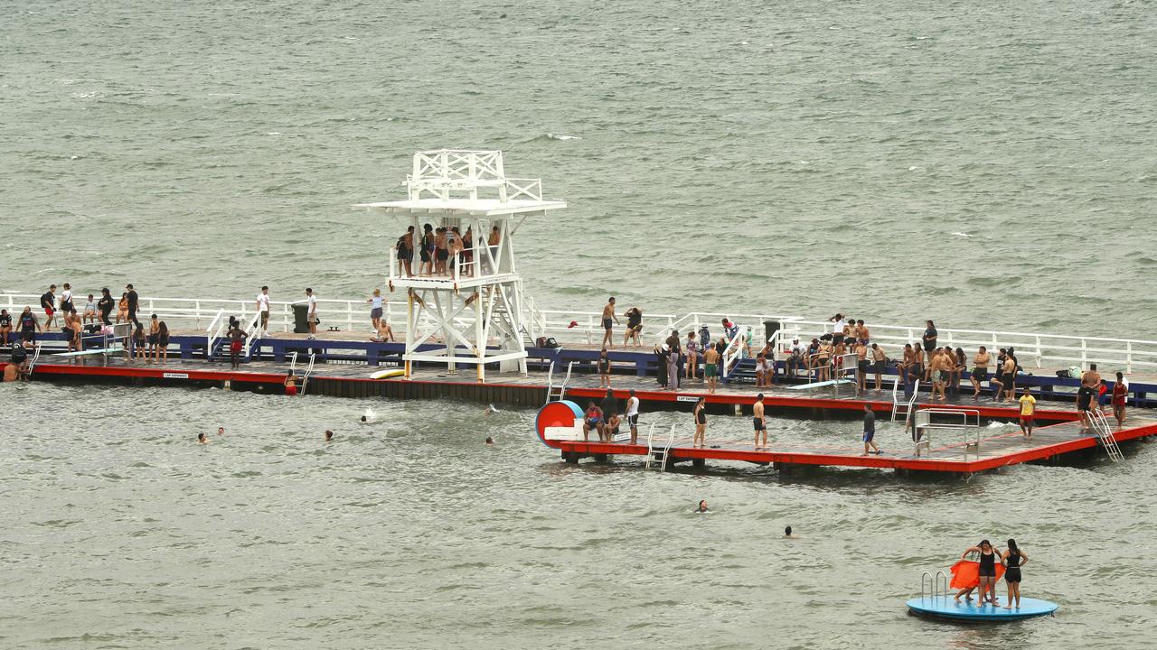 Beach goers cooling off on Boxing Day 2024 at Geelong's Waterfront. Picture: Alison Wynd