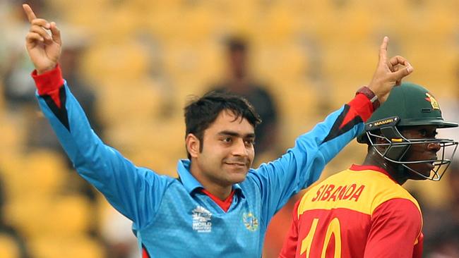 Afganistan's Rashid Khan (L) celebrates a wicket.