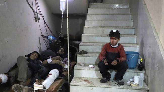 Wounded Syrians wait to receive treatment at a makeshift hospital in Kafr Batna in the besieged Eastern Ghouta. Picture: Amer. Almohibany/AFP