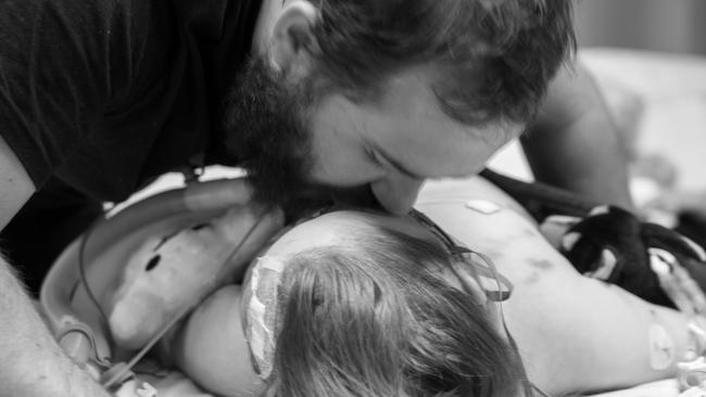 Tim Masters with his ‘amazing’ daughter Maci-Louise while she was in hospital. Picture: Supplied