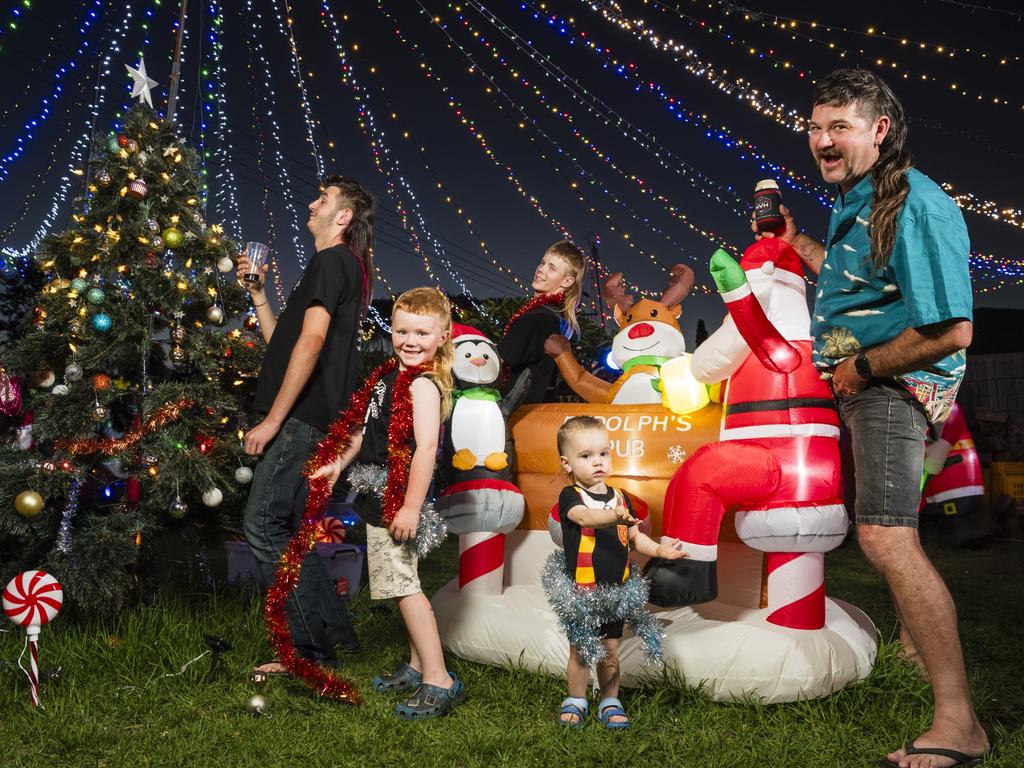 Mulletfest 2023 family category winners (from left) Alex Paynter, Theodore Berghofer, Cruise Nicol, Ryan Williams (back) and Brett Paynter at the Warwick St Christmas lights display of the Paynter family, Friday, December 8, 2023. Picture: Kevin Farmer