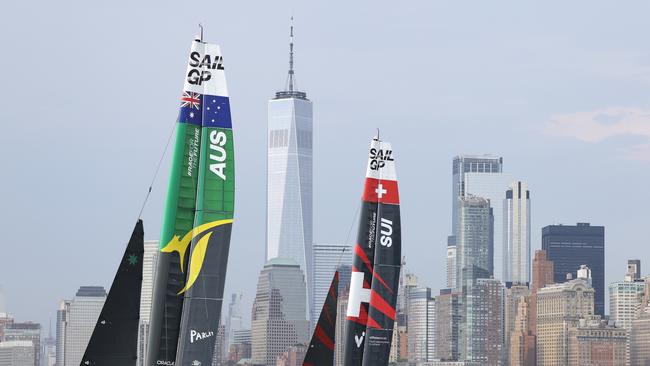 NEW YORK, NEW YORK - JUNE 22: Team Australia and Team Switzerland compete during day one of competition of SailGP New York on June 22, 2024 in New York City. (Photo by Luke Hales/Getty Images)
